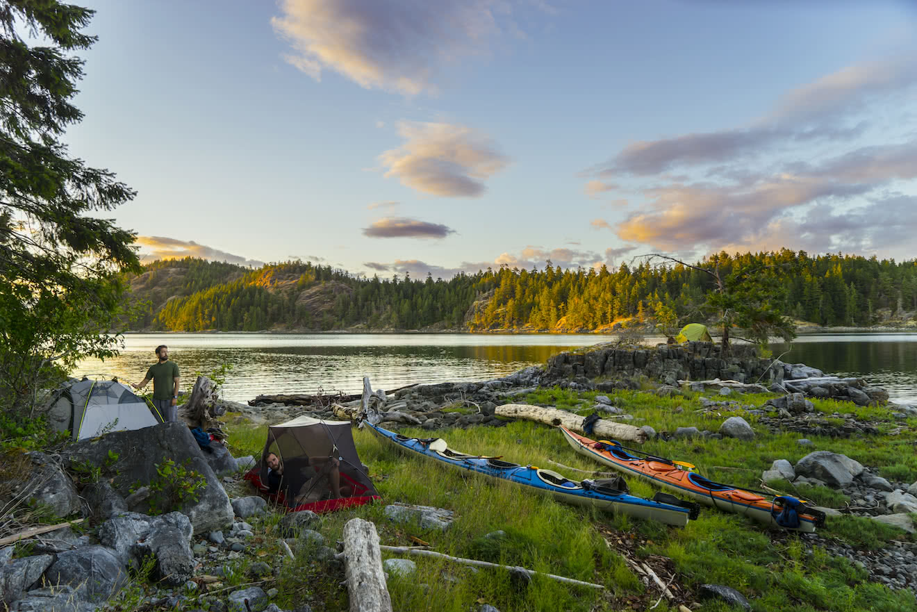 A group of campers on a desolation sound kayaking expedition tour in British Columbia