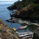 Kayaks tied up at lunch in Copeland Islands in Desolation Sound during one of our Lund kayak tours