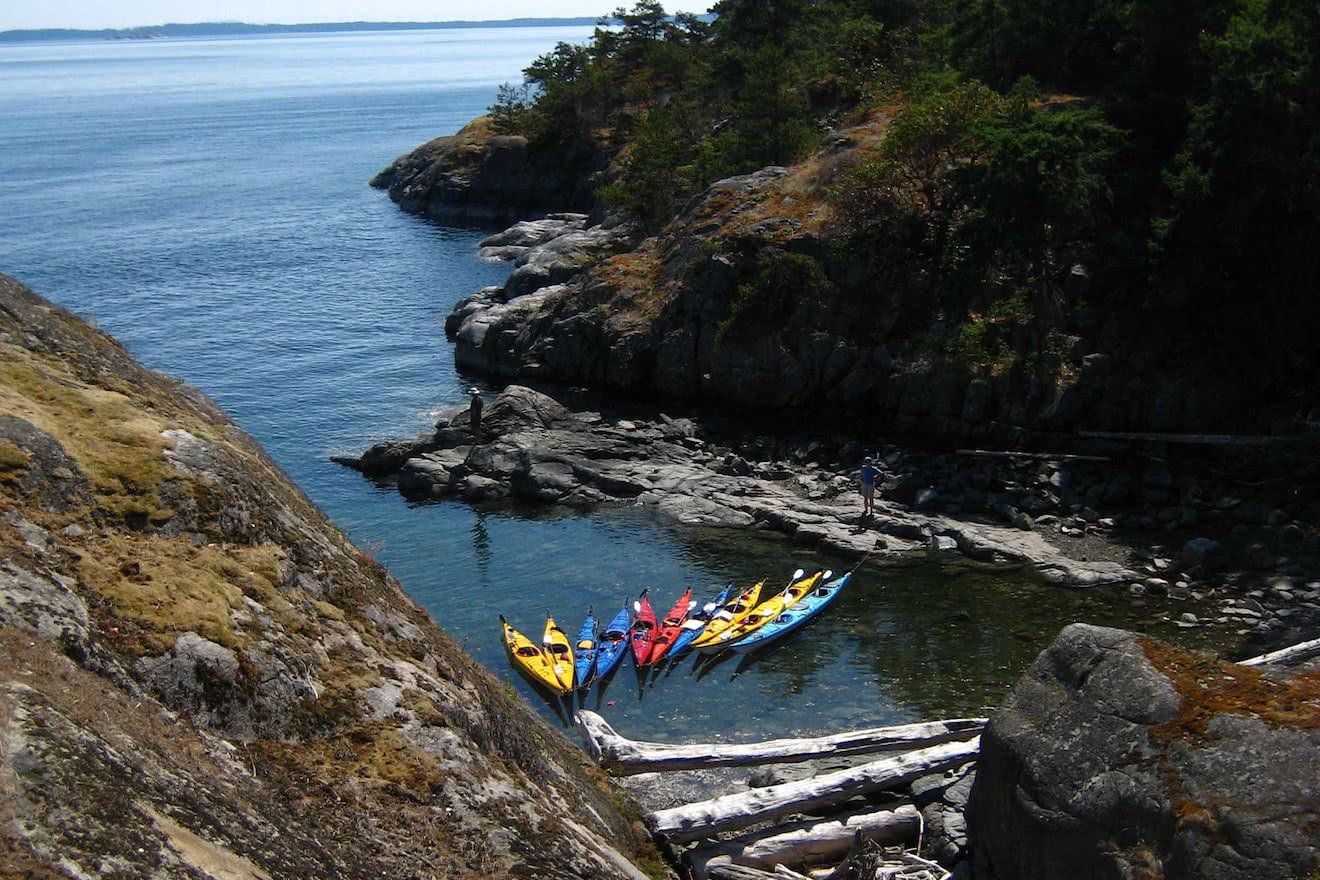 Kayaks tied up at lunch in Copeland Islands in Desolation Sound during one of our Lund kayak tours