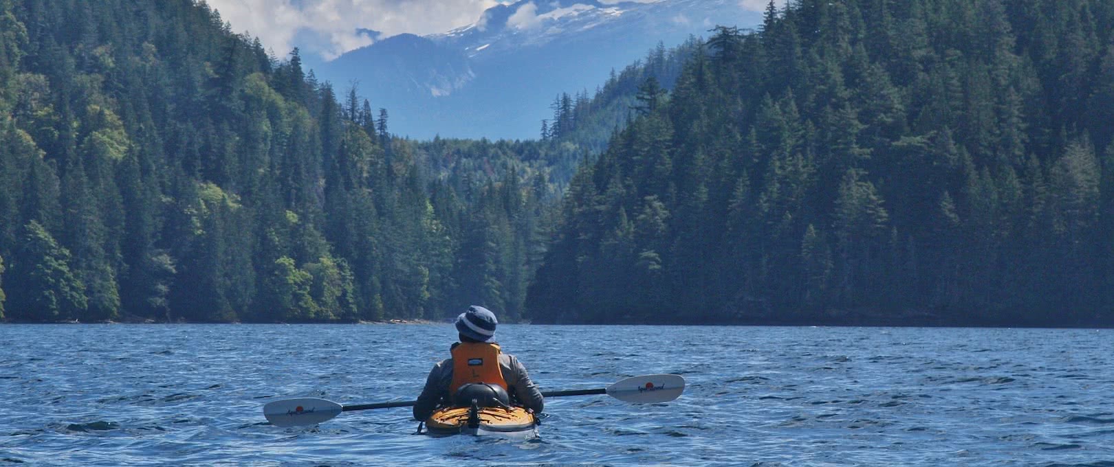 A kayaker sitting and enjoying the view on one of our 7 day sea kayak expeditions in Pryce Channel