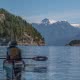A kayaker stares at Mount Denman in Desolation Sound BC