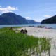 Kayakers stop for lunch on a sandy beach at the Brem River in Toba Inlet on a Desolation & Mountains kayak tour