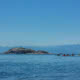 A group of sea kayakers paddling to Major Rock near the Copeland Islands