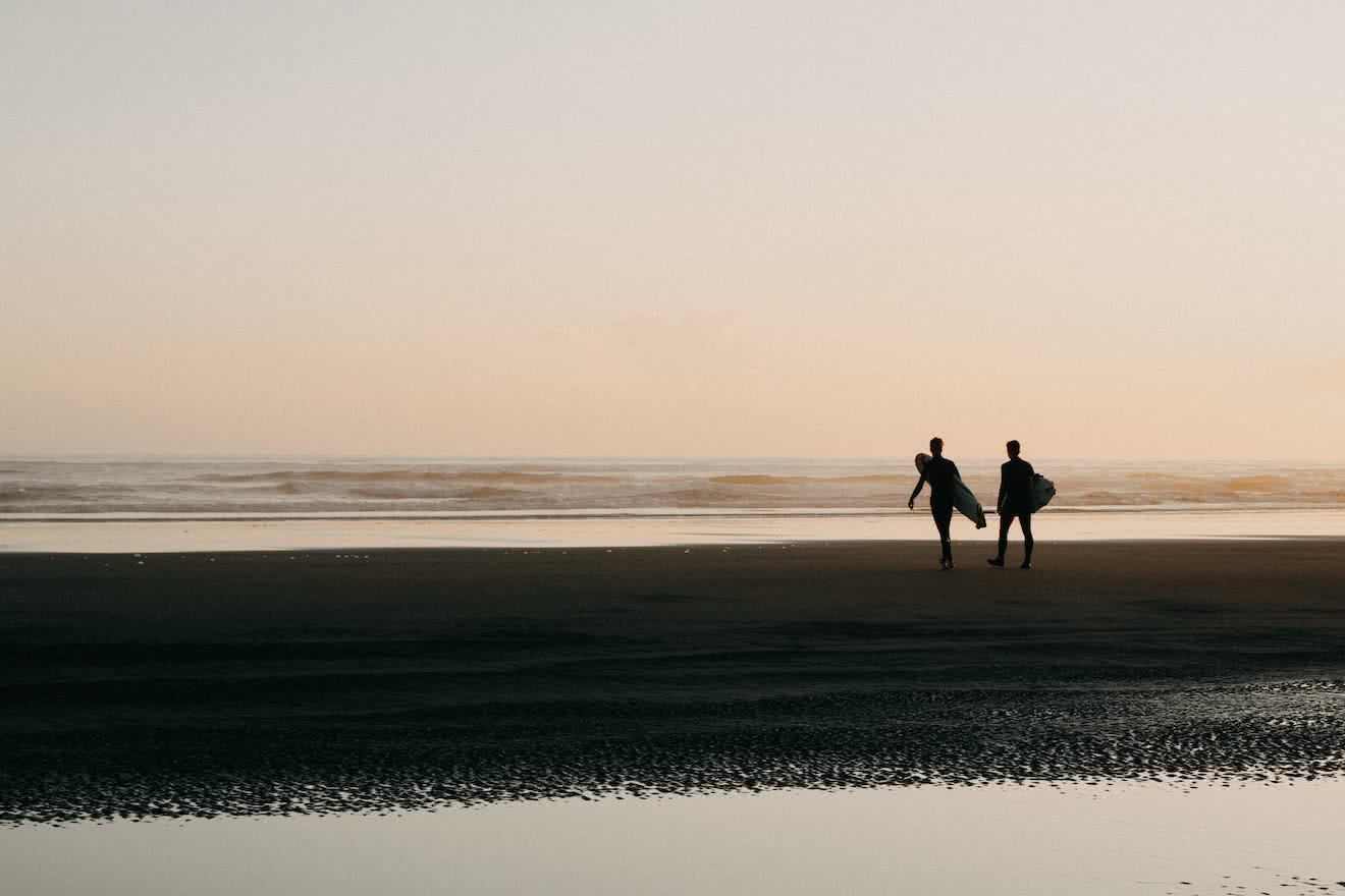 Two surfers in Tofino, British Columbia