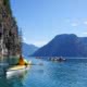 group of kayakers in blue water