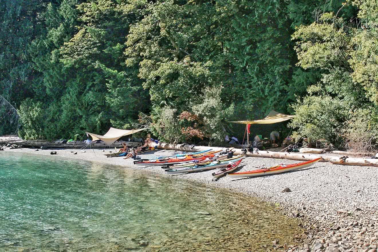 kayaks and shade on shore