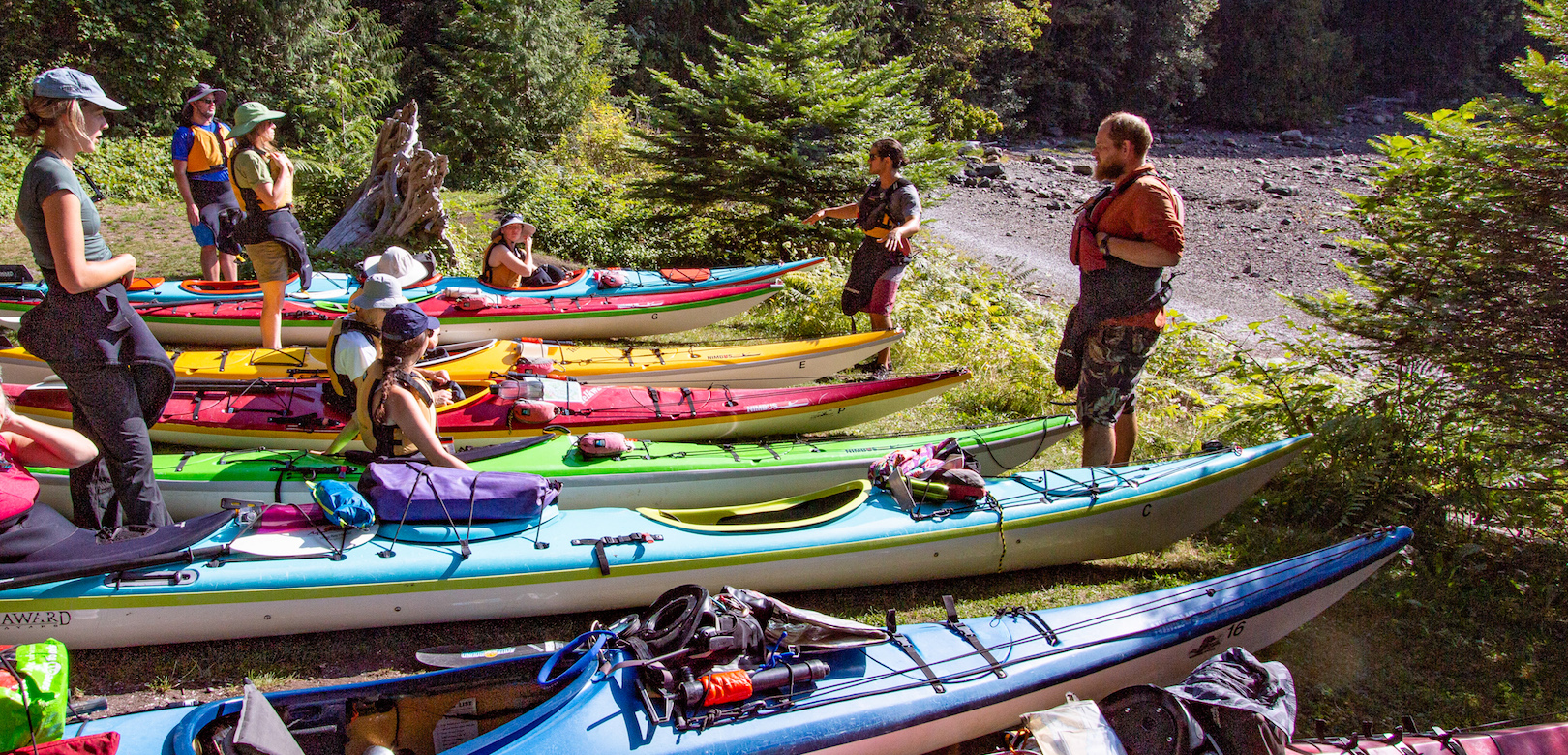 Guides talking guests through the safety orientation before a camping tour