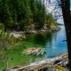10 colourful tour kayaks rafted together and floating in a bay in Desolation Sound