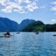 A guided kayak group leaving the rugged Pryce Channel mountains in the direction of Toba Inlet