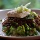 Seared halibut with soba noodles, grilled eggplant, bok choi, romanesco and locally sourced greens, with a tahini and black sesame sauce