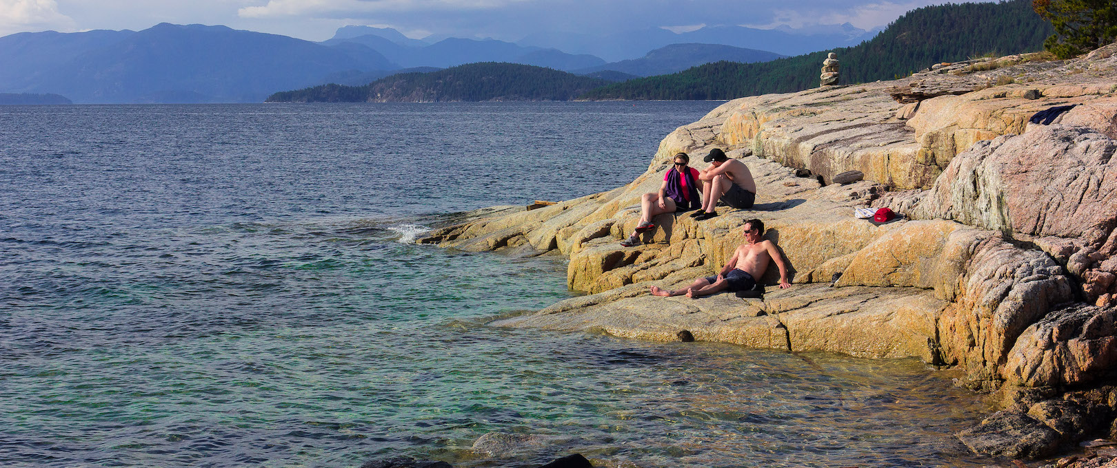 Guests laze and relax in the sun on one of our kayak vacations