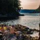 Two guests relax on the rocks after swimming at the Martin Islands on a kayak tour