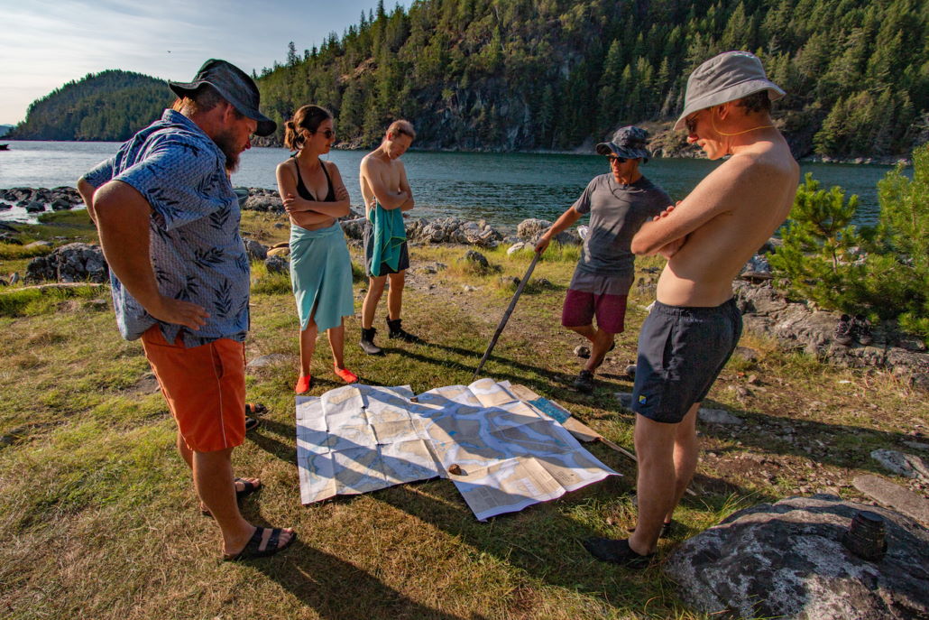 looking at a map on shore