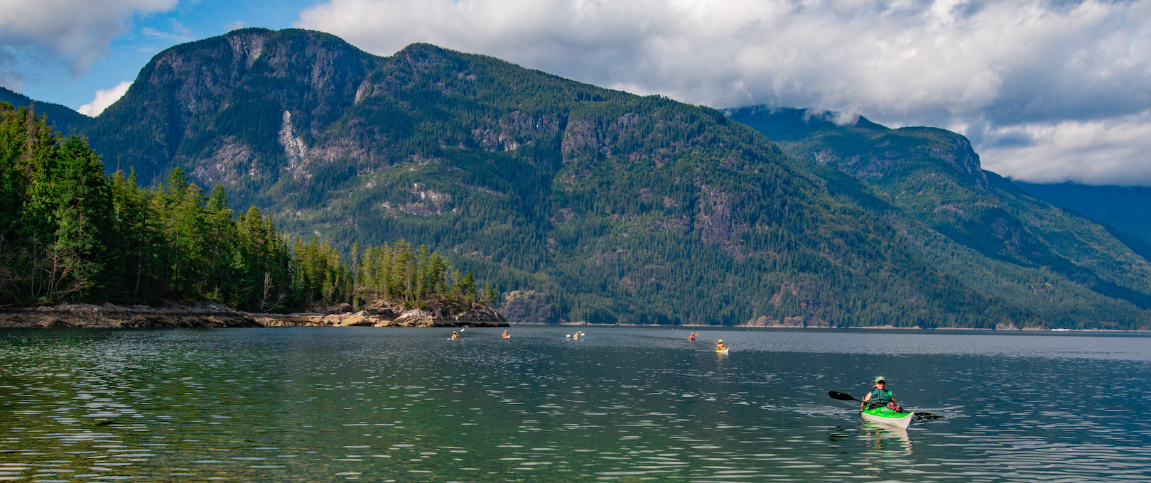 Landing a group near Toba Inlet on one of PRSKs sea kayak expeditions