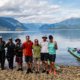 One of our multi-day kayak tours posing at the mouth of Toba Inlet