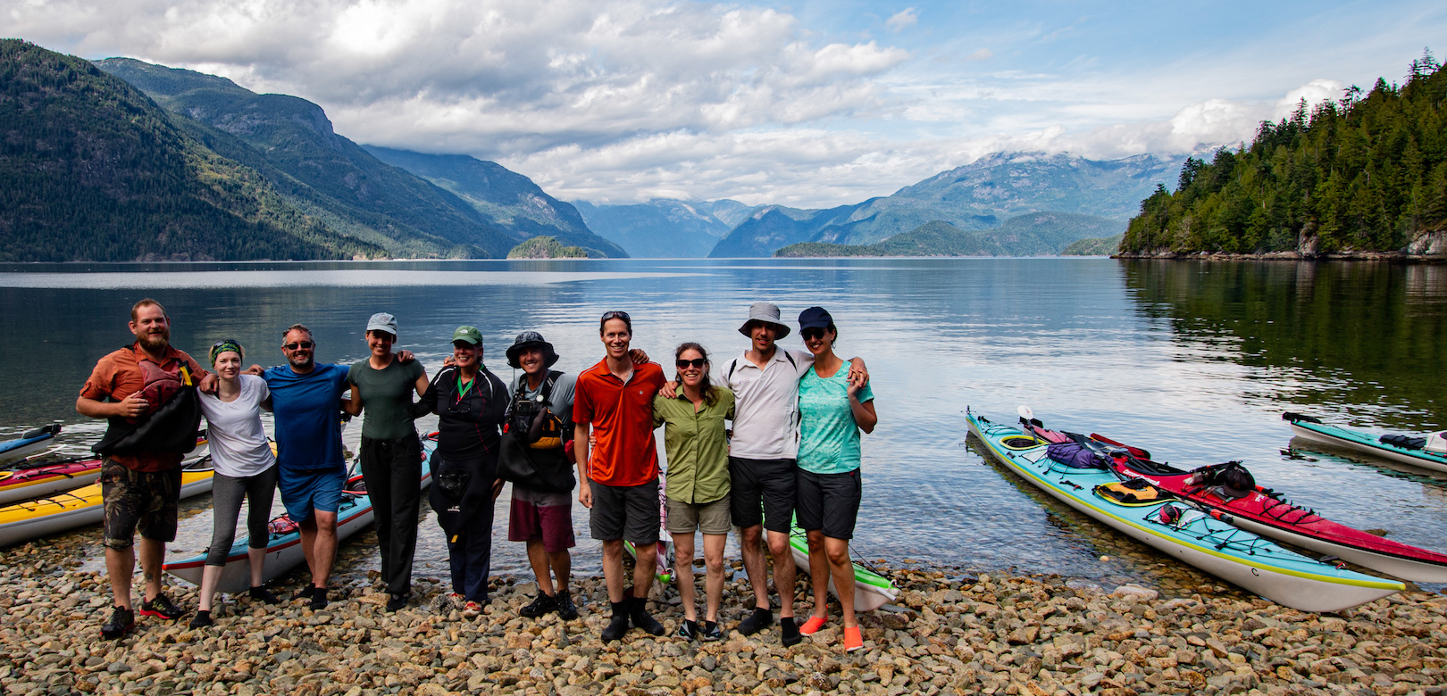 One of our multi-day kayak tours posing at the mouth of Toba Inlet