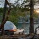 An MSR tent and som gear on a tent platform in the Curme Islands in Desolation Sound with a sunset