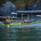 Father and son kayaking in Desolation Sound on a family kayaking trip