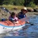 Mother and daughter paddling a double kayak