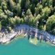 view of blue water and cabins from above