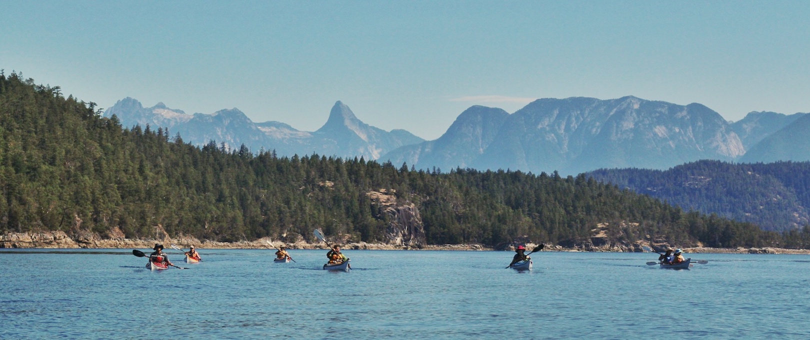 group of kayakers paddling