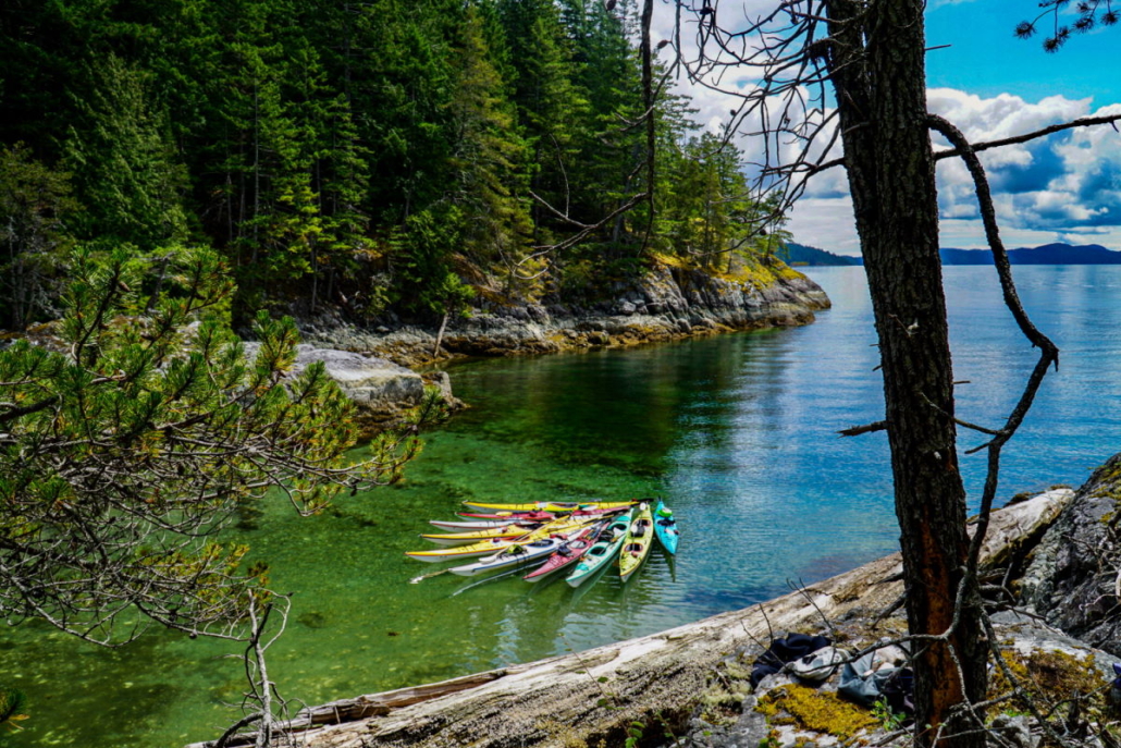 bunch of kayaks tied together in the water