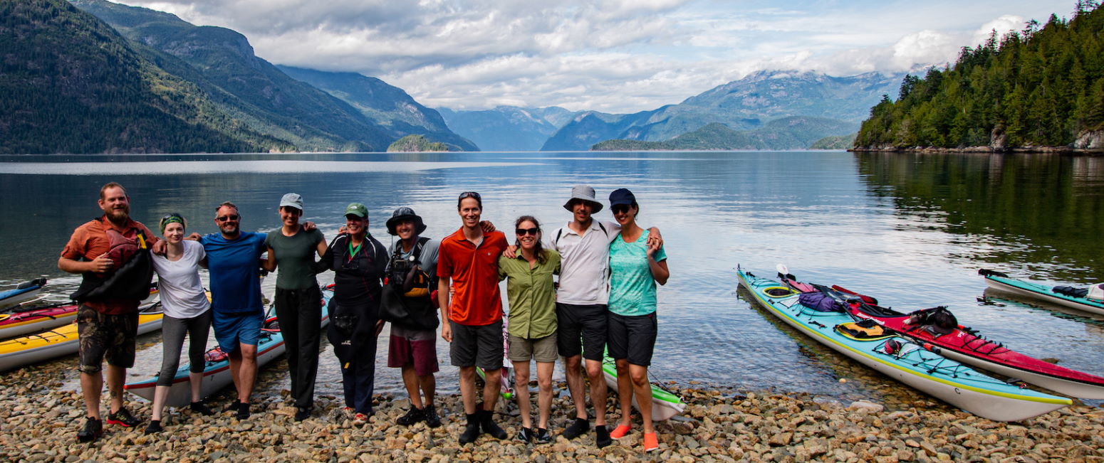 expedition group lined up along shore