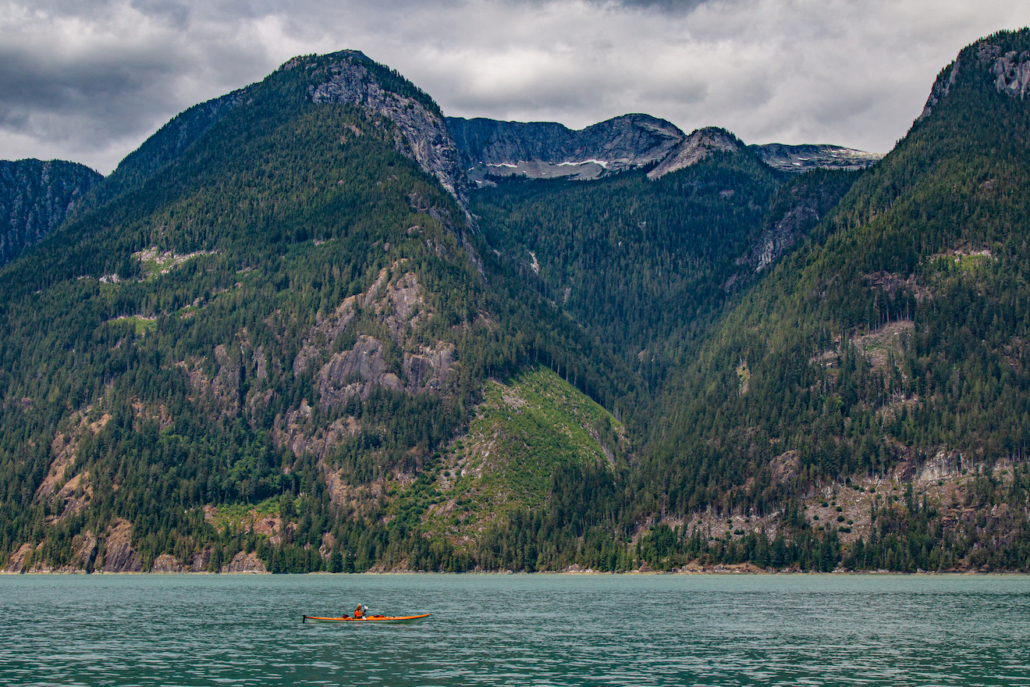 Big mountains and a kayaker in Toba Inlet